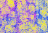 Colored watercolor background. Splashes of paint on paper. Bright yellow-blue-violet background.