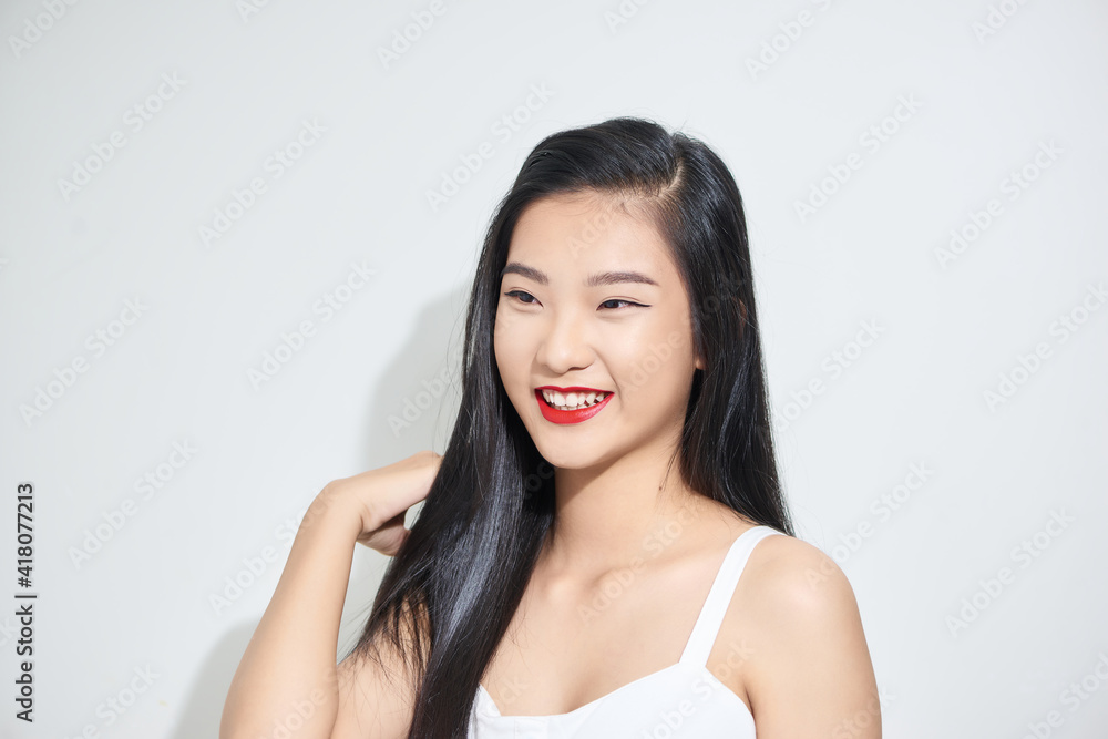 Beautiful happy asian women portrait smiling wearing black shirt on white background Beautiful happy asian women portrait smiling wearing black shirt on white background