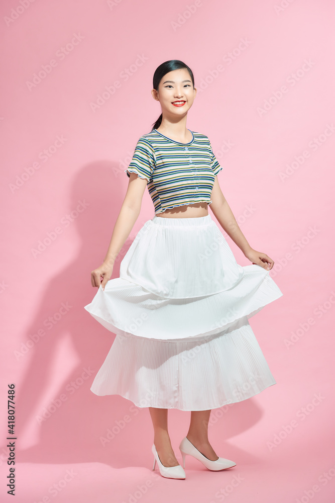 Gorgeous happy lady with long white skirt turn around with pleasure enjoying weekend Gorgeous happy lady with long white skirt turn around with pleasure enjoying weekend
