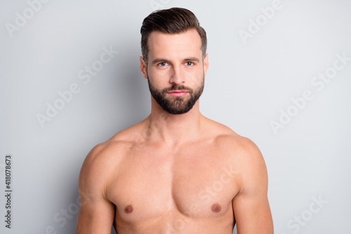 Close-up portrait of attractive content serious well-groomed naked brunet guy isolated over light grey color background