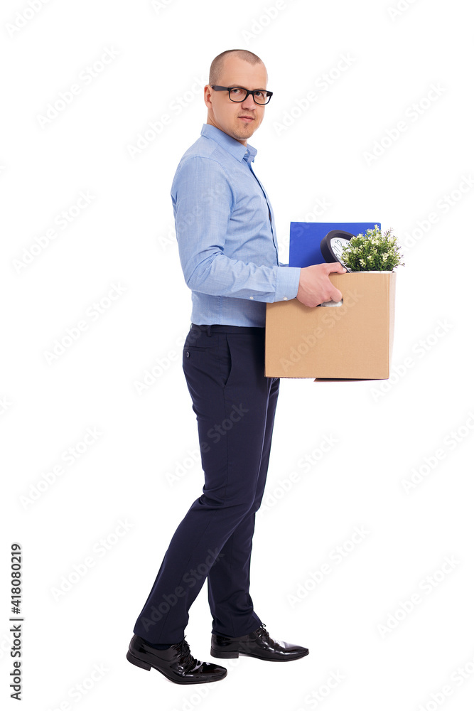 last working day or dismissal concept - side view of business man walking with his belongings in cardboard box isolated on white last working day or dismissal concept - side view of business man walking with his belongings in cardboard box isolated on white