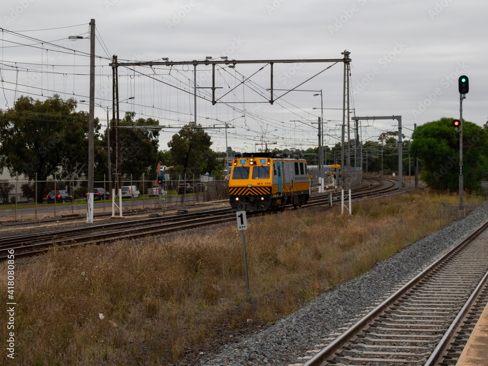 Commuter train approaching a train station in Melbourne Victoria Australia Commuter train approaching a train station in Melbourne Victoria Australia