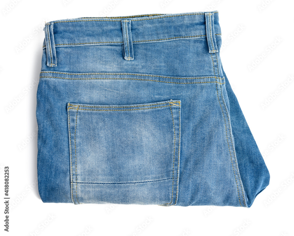 folded blue men's jeans on a white background folded blue men's jeans on a white background