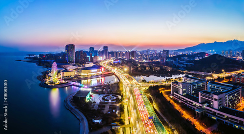 Aerial photography of the night view of the urban architectural landscape of Qingdao  China