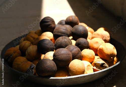 Black lime in ancient silver bowl photo