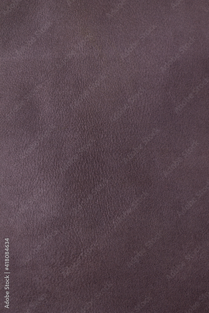 Fototapeta premium Background. Texture. Lambskin is brown in color. Vertical orientation. 