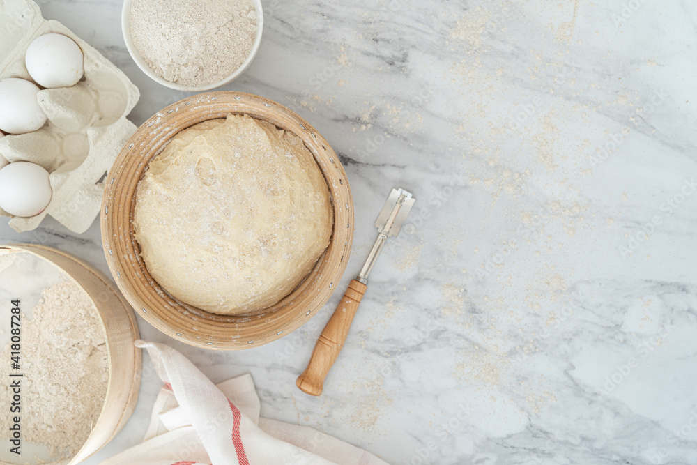 Homemade bread concept - ingredients on marble background, top view Homemade bread concept - ingredients on marble background, top view