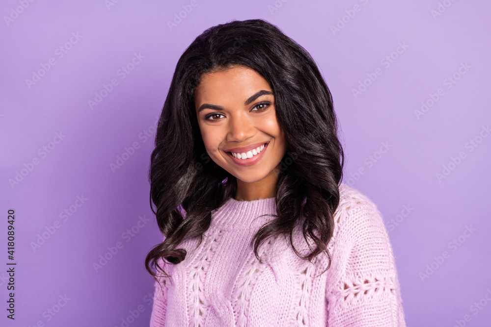 Fototapeta premium Photo of sweet adorable dark skin lady dressed knitted pullover smiling isolated purple color background