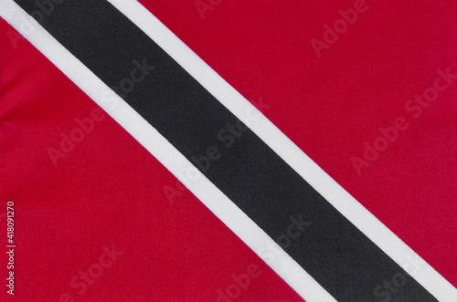 fabric of the national flag of the Republic of Trinidad and Tobago close-up