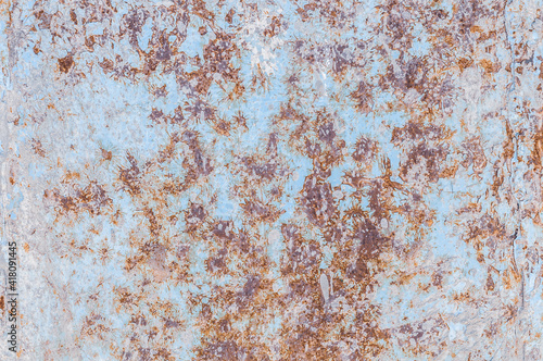 Oxidized rough texture, brown rust with peeling blue paint. Rusty metal surface, not painted, outdoors, close-up photo.