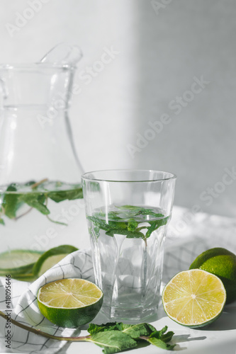Detox water with lime fruit and mint leaves. Mint fresh homemade lemonade