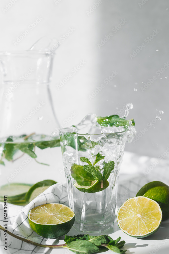 Detox water with lime fruit and mint leaves. Mint fresh homemade lemonade Detox water with lime fruit and mint leaves. Mint fresh homemade lemonade