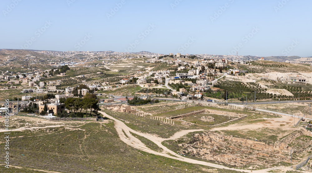 View  from the walls of the ruins of the palace of King Herod - Herodion of the nearby Jewish and Arab settlements in the Judean Desert, in Israel