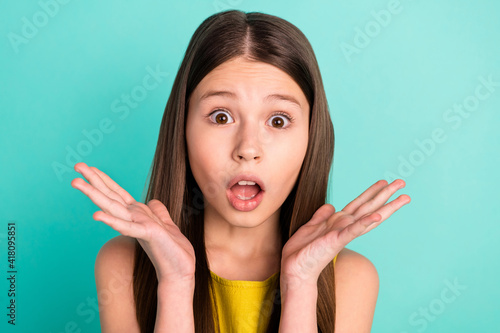 Photo of impressed nice brown hair girl wear yellow dress isolated on bright teal color background