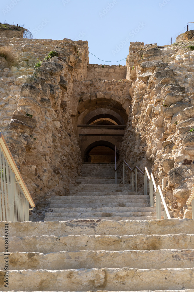 Rebuilt  stone staircase and entrance leading to the ruins of the palace of King Herod - Herodion in the Judean Desert, in Israel