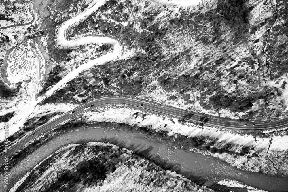 Obraz premium Aerial view on mountain road from drone in winter.