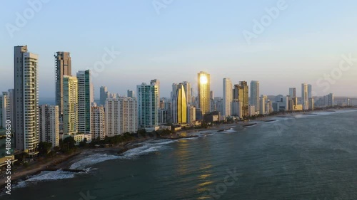 Aerial Establishing Shot of Beaches and Modern Skyscrapers at Sunset in Cartagena, Bolivar, Colombia. Near Playa Bocagrande photo