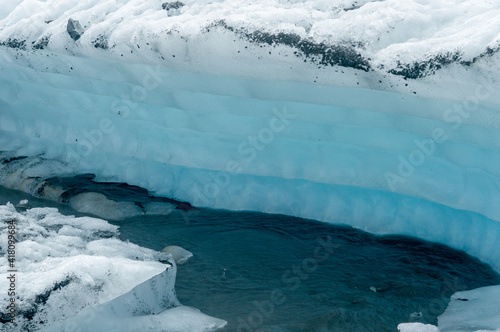 Blue and white glacier in cold beautiful Alaska