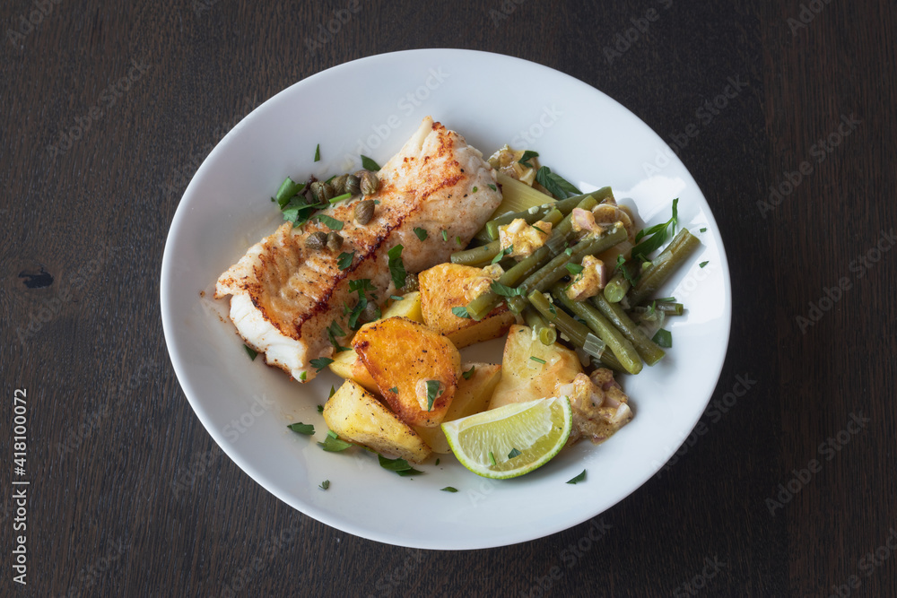 Baked white cod fish, bacalhau, with roasted potatoes and simple skillet green beans Baked white cod fish, bacalhau, with roasted potatoes and simple skillet green beans