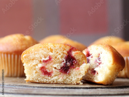 Delicious fresh muffins with berry filling photo