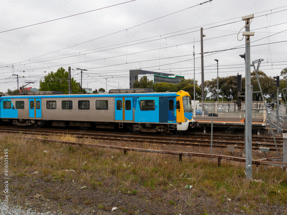Commuter train approaching a train station in Melbourne Victoria Australia Commuter train approaching a train station in Melbourne Victoria Australia