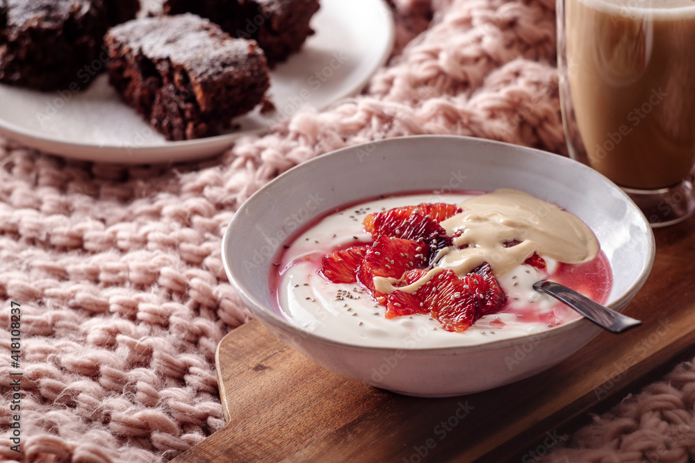 Fresh healthy breakfast greek yogurt with blood oranges, cashew butter and chia seeds Fresh healthy breakfast greek yogurt with blood oranges, cashew butter and chia seeds