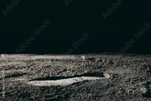 Foto Footprint on the moon against a black background