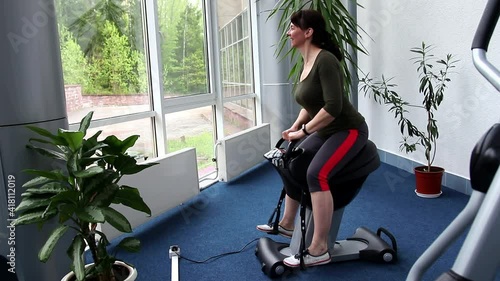 athletic woman on the simulator 