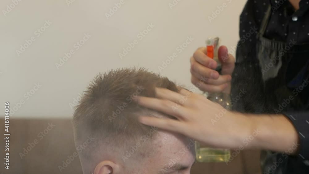 At home handsome guy have a professional haircut At home handsome guy have a professional haircut