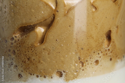 coffee milk foam in a glass close-up meal background
