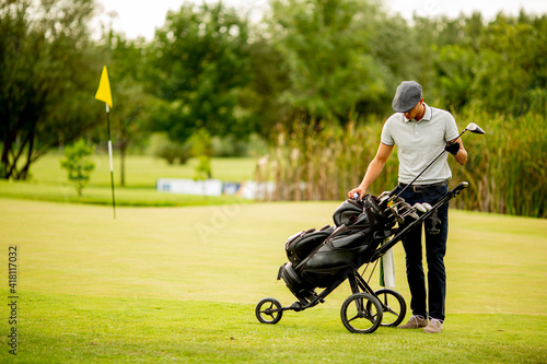 Young man playing golf