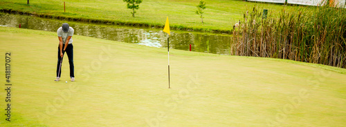 Young man playing golf