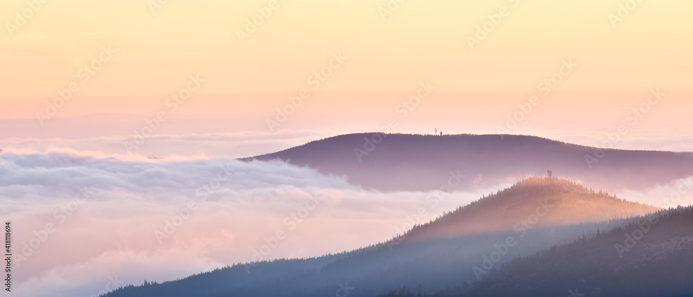 Fog in the mountain valley, view from the Snieznik peak at sunset.