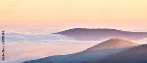 Fog in the mountain valley, view from the Snieznik peak at sunset.