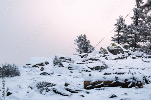 Viewpoint Trojmorski Wierch, rocks covered with snow. photo