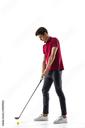 Quite composed. Golf player in a red shirt isolated on white studio background with copyspace. Professional player practicing with emotions and facial expression. Sport, motion, action concept.