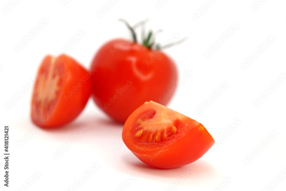Red tomato whole and sliced on white background isolated Red tomato whole and sliced on white background isolated
