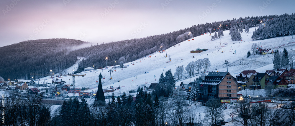 View of the Zieleniec ski slope in the evening time.