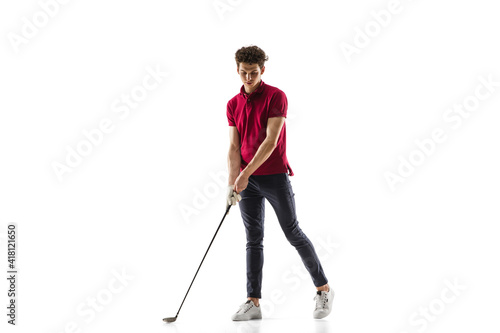 Objective. Golf player in a red shirt isolated on white studio background with copyspace. Professional player practicing with emotions and facial expression. Sport, motion, action concept.