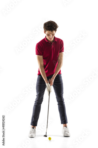 Objective. Golf player in a red shirt isolated on white studio background with copyspace. Professional player practicing with emotions and facial expression. Sport, motion, action concept. © master1305