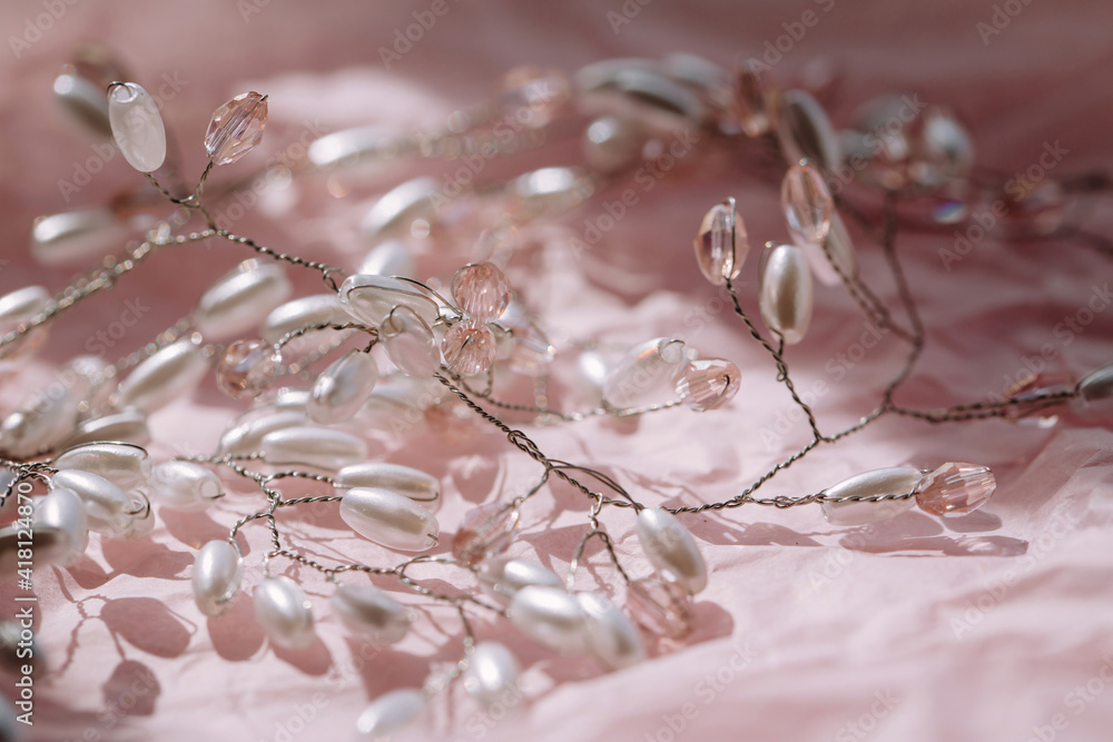Bridal hair jewelry made of pink crystals and pearls.