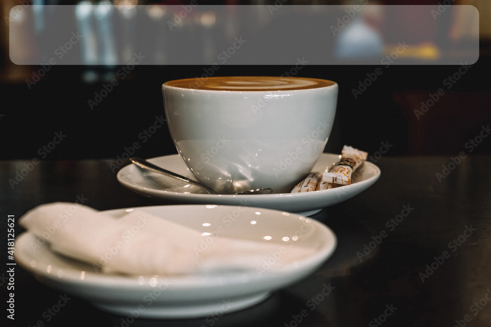 Mug with a saucer, latte, three bags of sugar, spoon, with film grain Mug with a saucer, latte, three bags of sugar, spoon, with film grain