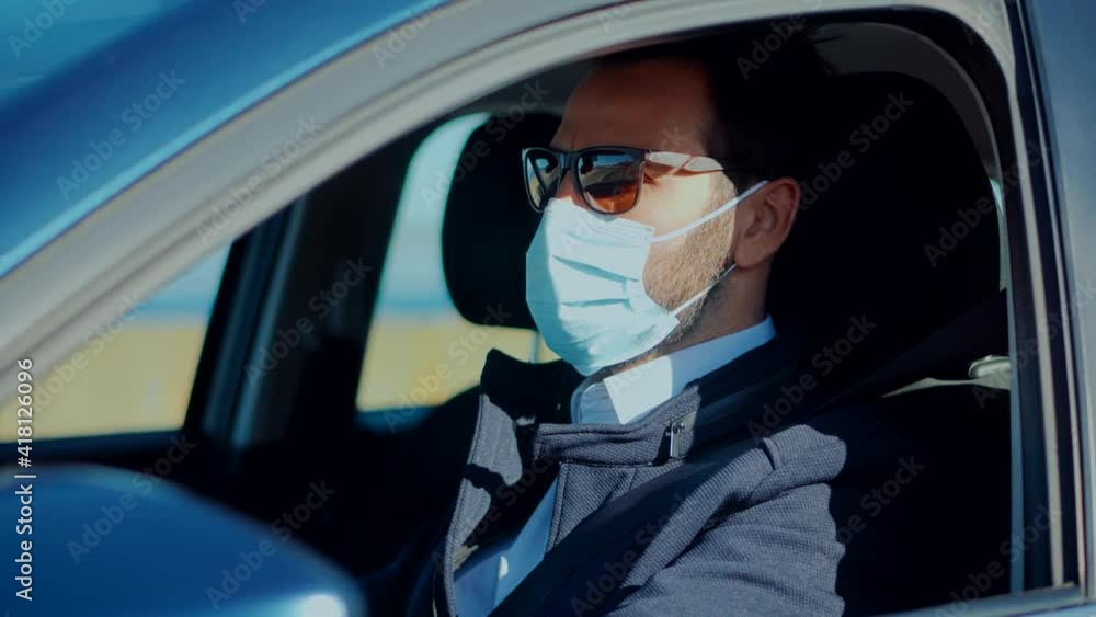 Self Isolation On Car On Covid19 Lockdown Coronavirus Quarantine.Man In Face Mask Driving Car On Covid19 Lockdown Coronavirus.Driver Protective Face Mask In Car.Businessman In Sunglasses Drive Vehicle Self Isolation On Car On Covid19 Lockdown Coronavirus Quarantine.Man In Face Mask Driving Car On Covid19 Lockdown Coronavirus.Driver Protective Face Mask In Car.Businessman In Sunglasses Drive Vehicle