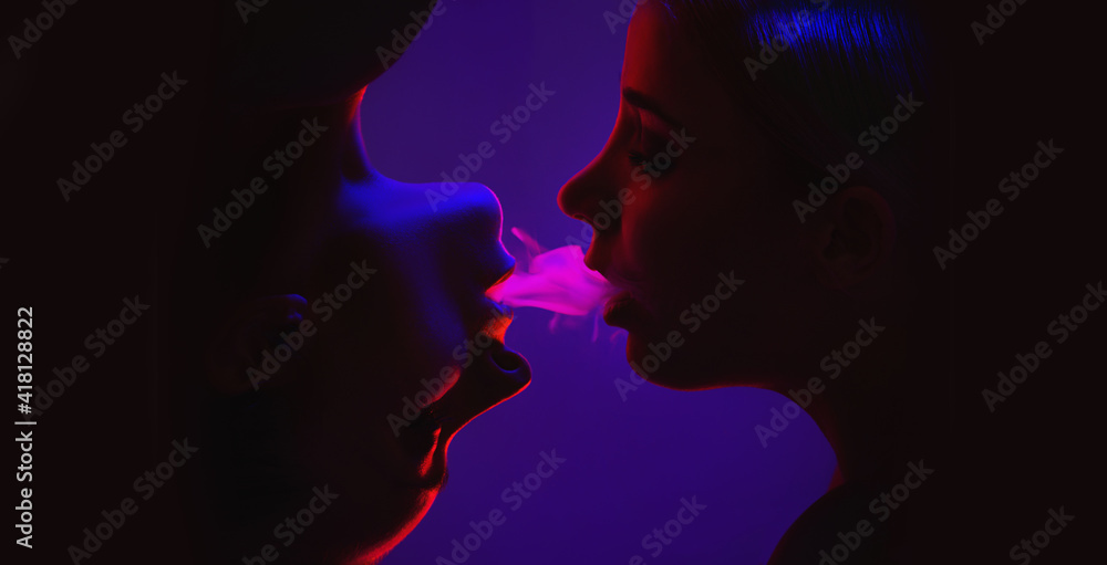 High fashion models in colorful bright neon lights - concept of being together