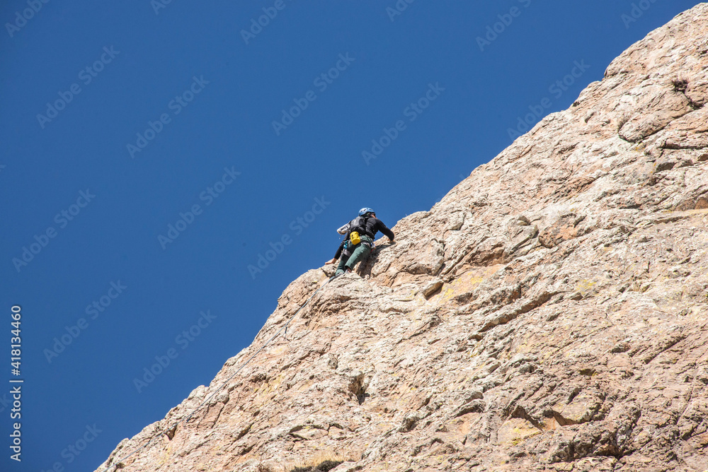 A rock climber on Peña de Bernal, UNESCO site and one of the world’s largest monoliths, Queretaro, Mexico