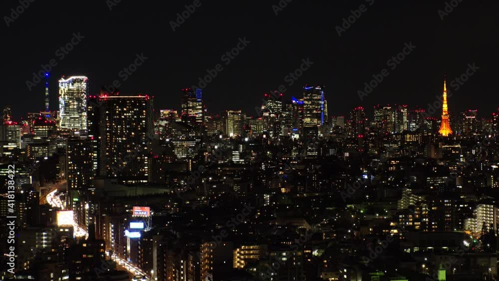 TOKYO, JAPAN : Aerial view of CITYSCAPE of TOKYO at night. View of busy central downtown area (Shibuya and Roppongi). Japanese urban metropolis and nightlife concept. Time lapse zoom out shot. TOKYO, JAPAN : Aerial view of CITYSCAPE of TOKYO at night. View of busy central downtown area (Shibuya and Roppongi). Japanese urban metropolis and nightlife concept. Time lapse zoom out shot.