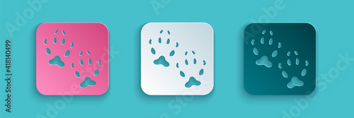 Paper cut Fox paw footprint icon isolated on blue background. Paper art style. Vector.