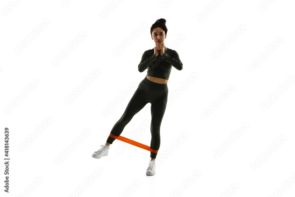 Cardio. Young caucasian female model in action, motion isolated on white background with copyspace. Concept of sport, movement, energy and dynamic, healthy lifestyle. Training, practicing. Cardio. Young caucasian female model in action, motion isolated on white background with copyspace. Concept of sport, movement, energy and dynamic, healthy lifestyle. Training, practicing.