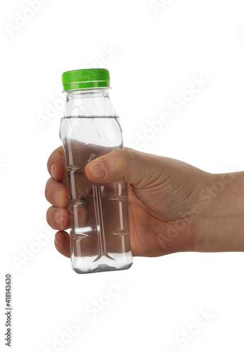 a small plastic bottle in a hand