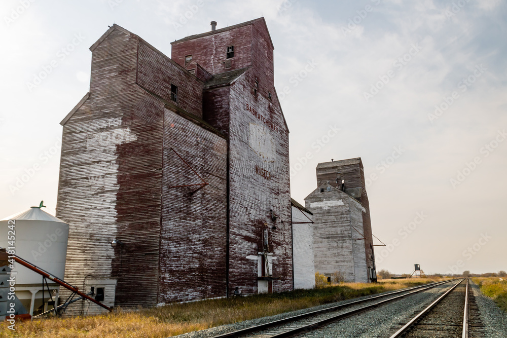 Three red and white grain eleavotrs and trains. Waseca, Saskatchewan, Canada Three red and white grain eleavotrs and trains. Waseca, Saskatchewan, Canada